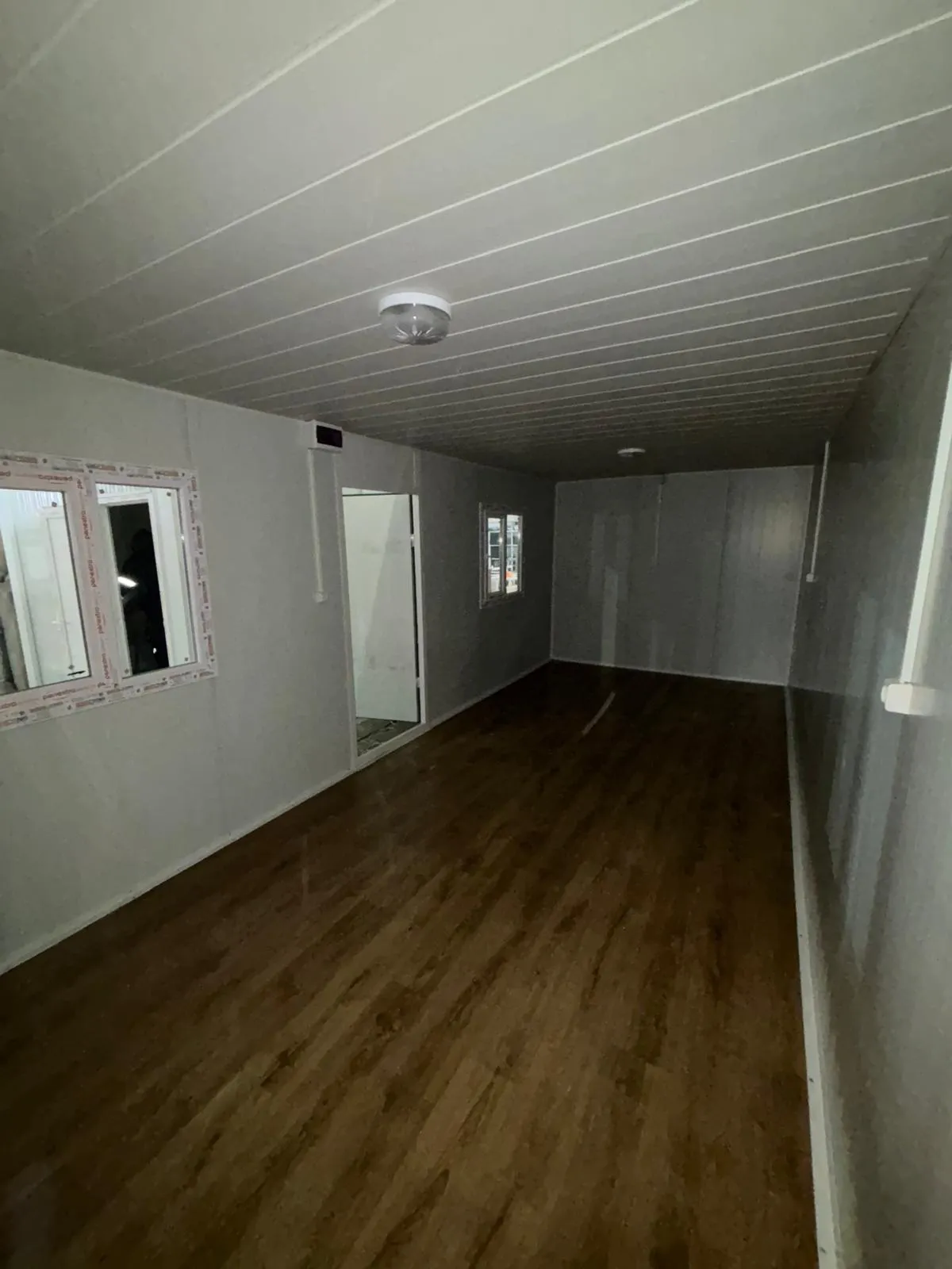 Structural frame during flat pack house assembly services process in workshop.