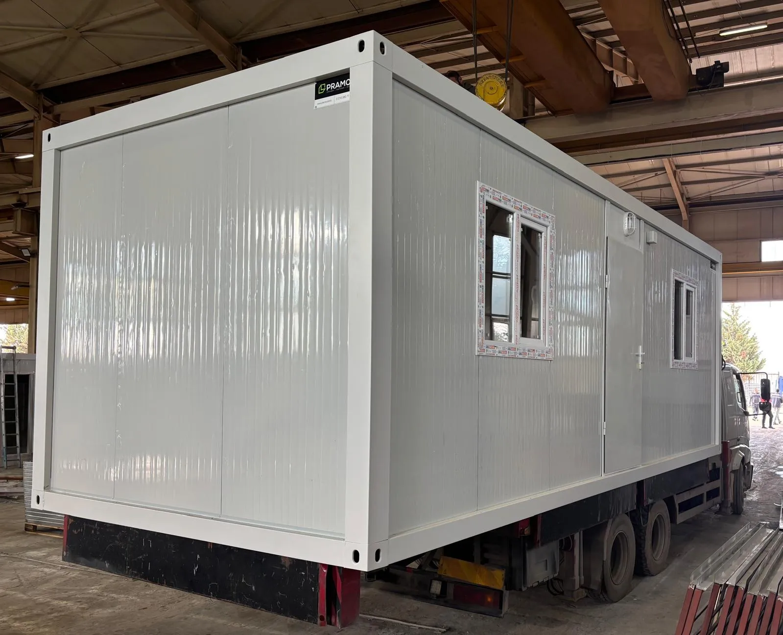 Flat pack house assembly services for customizable modular container homes.